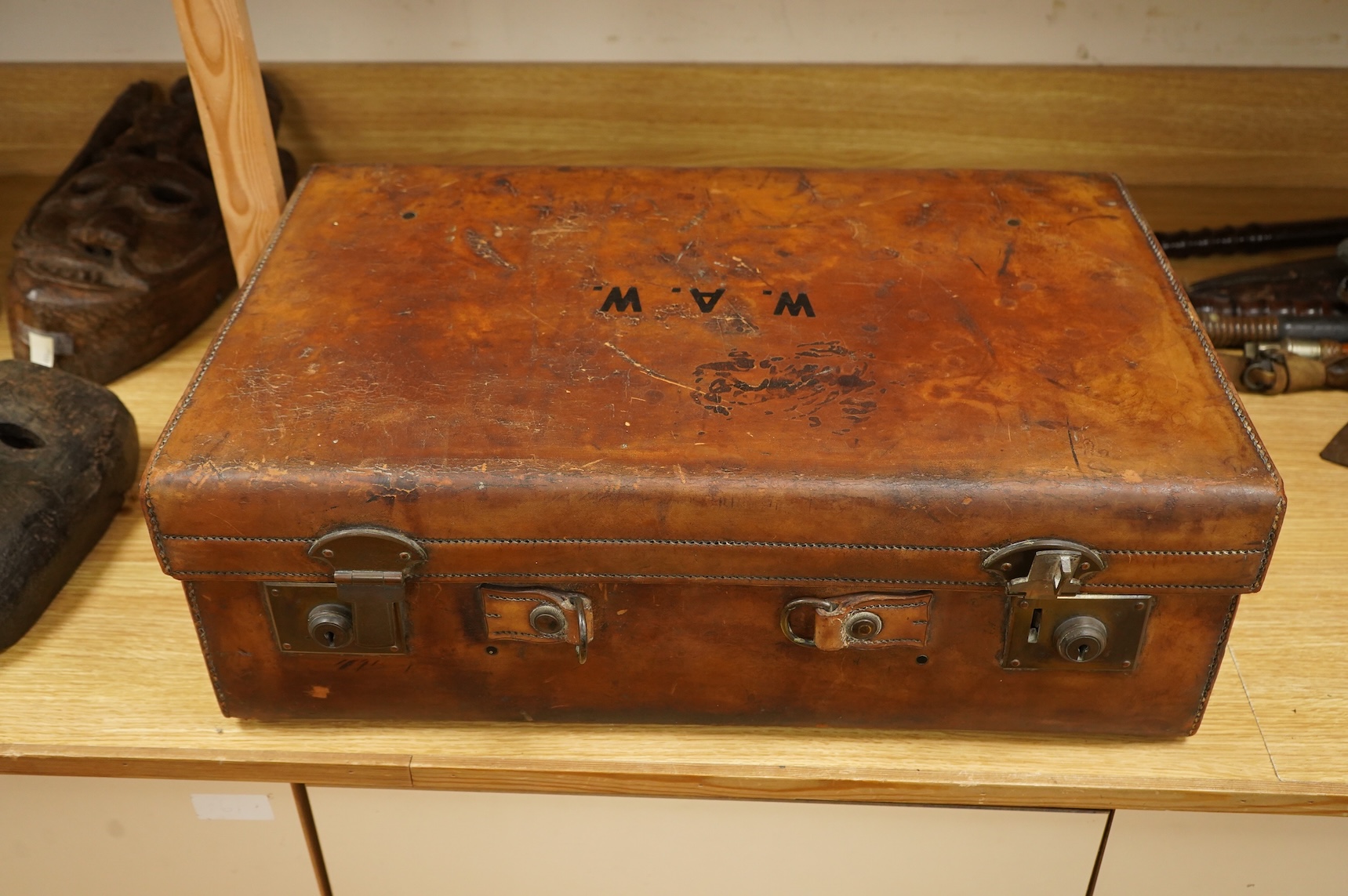 A leather toilet case with silver mounted contents, 61cm wide